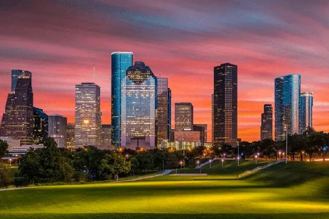 Houston skyline at sunset showcasing modern skyscrapers, symbolizing urban development and business growth for FileMaker Pro solutions.